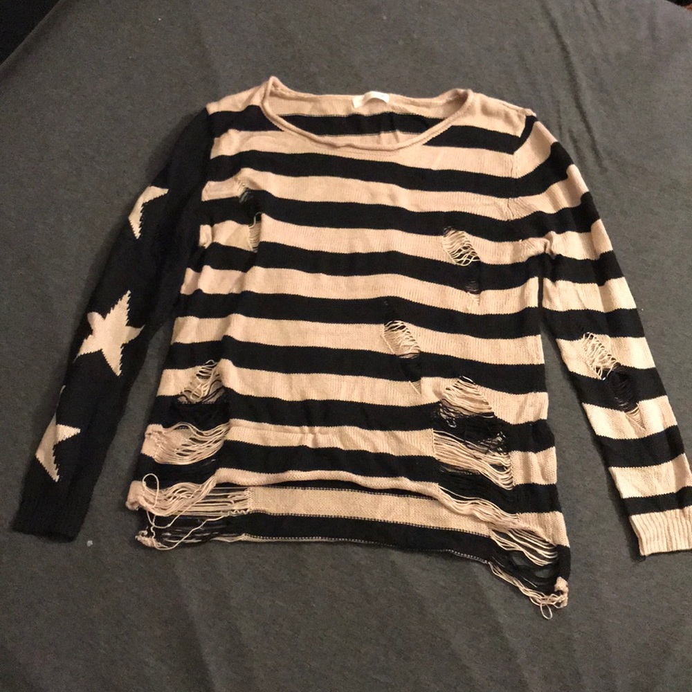 Edgy ripped striped sweater